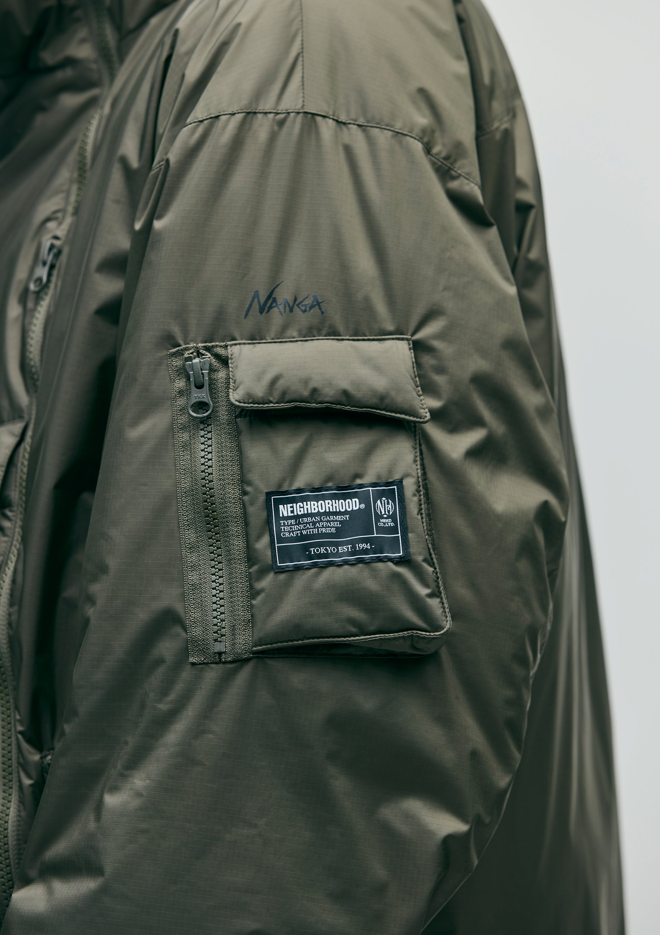 NH X NANGA . DOWN JACKET